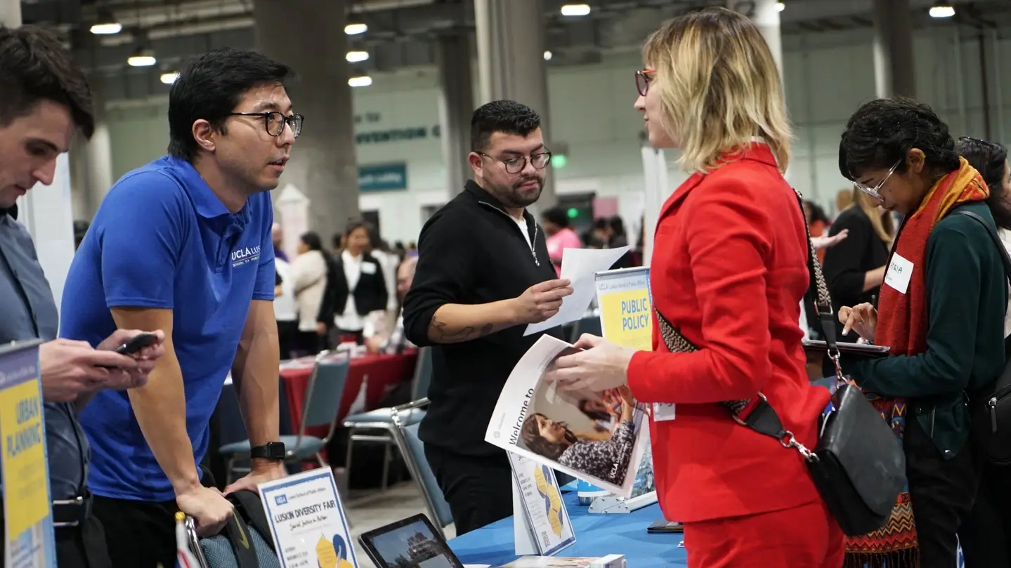 University recruiter speaking to an attendee.