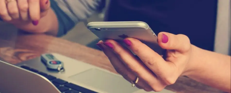 A woman looking at her phone.